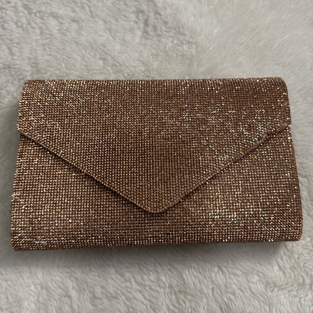 Rose gold ALDO clutch with defect